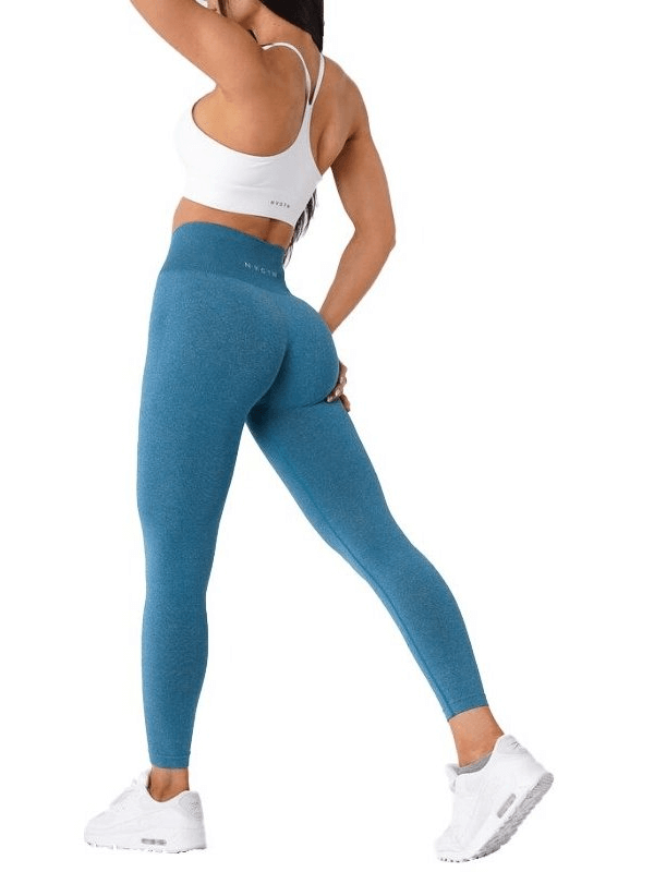 Model wearing blue Tight Elastic Women's Leggings, perfect for yoga and fitness, showcasing flexibility and comfort.